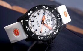DayNight 43 Solar &mdash; White Dial, White Bezel Accents, Orange Hands, Orange & White & Green Lume